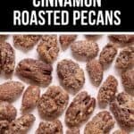 A close-up of Cinnamon Roasted Pecans arranged on a parchment-lined surface, with a banner at the top reading "Easy Cinnamon Roasted Pecans.