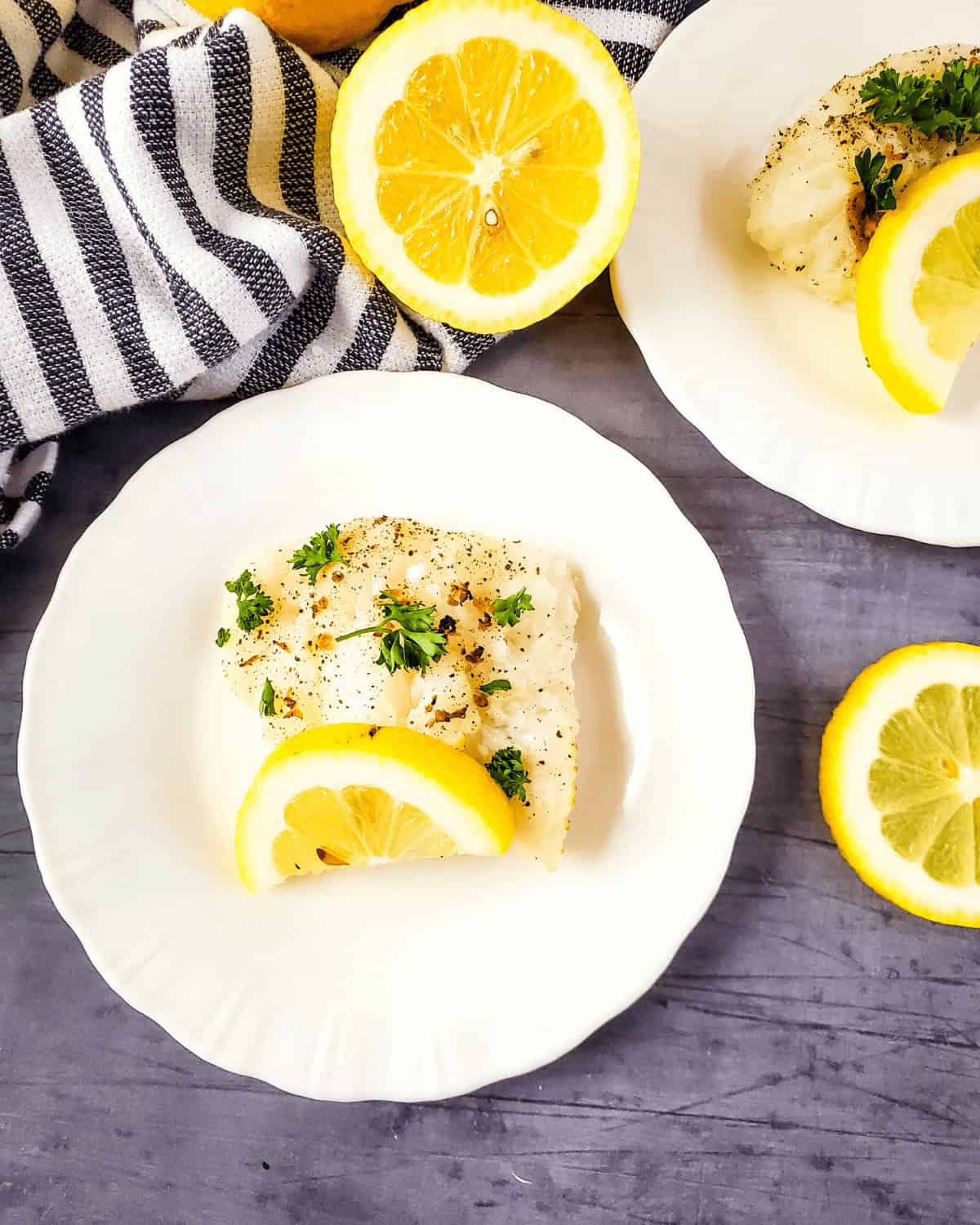 A plate of the finished meal with a blue and white strip towel.