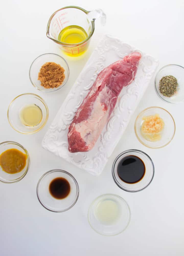  Pork Loin Roast with sauces and seasonings on a plate.
