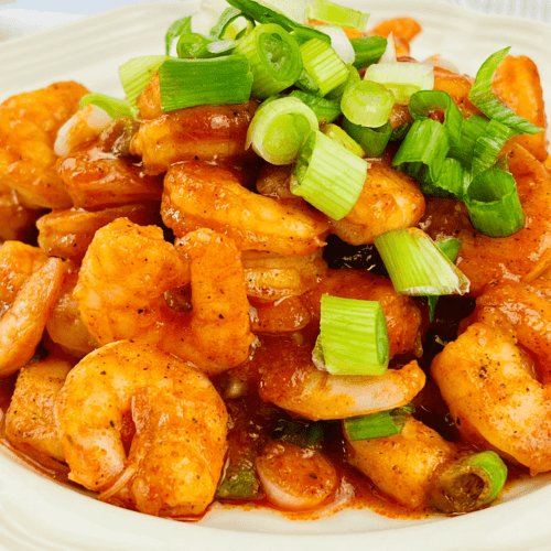 Buffalo Shrimp on a white plate.