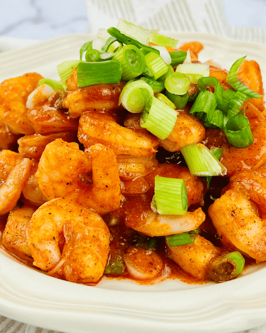 Buffalo Shrimp on a white plate.
