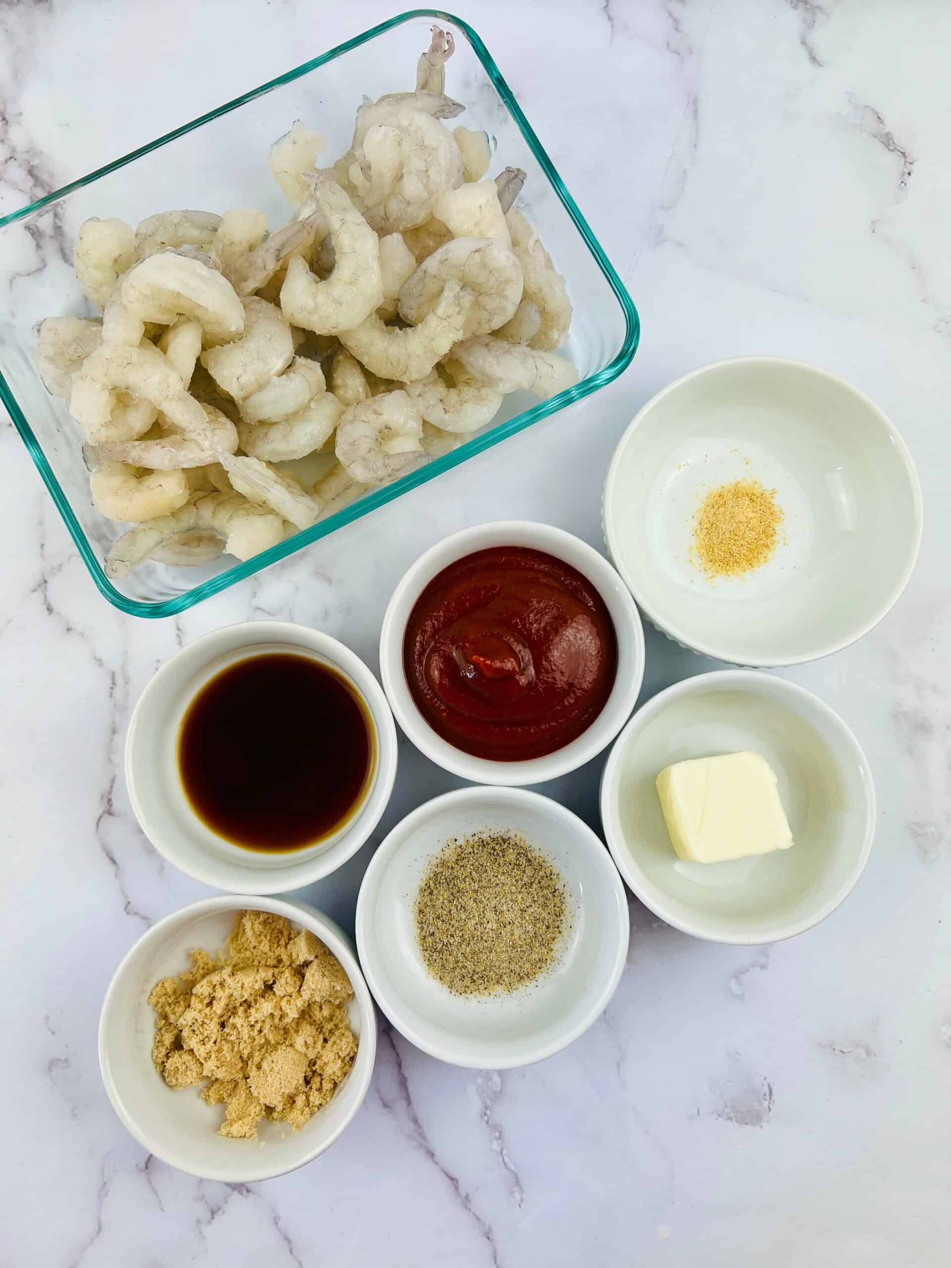 The ingredients for dish including hot sauce, butter and seasonings.