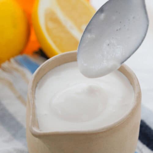 A pitcher of lemon tahini dressing.