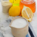 The sauce with lemon pieces beside it.