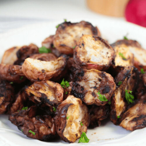 Grilled mushrooms on a white plate.