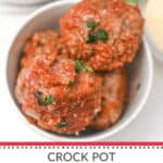 Crock pot Italian sausage meatballs simmering in a bowl.