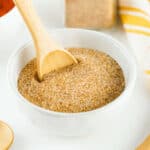 A white bowl with homemade seasoned salt, cinnamon, and nutmeg.