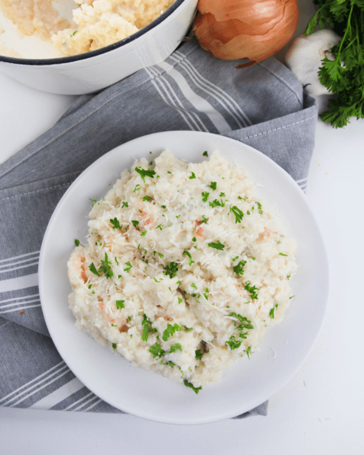 Creamy shrimp  risotto topped with fresh parsley and minced garlic.