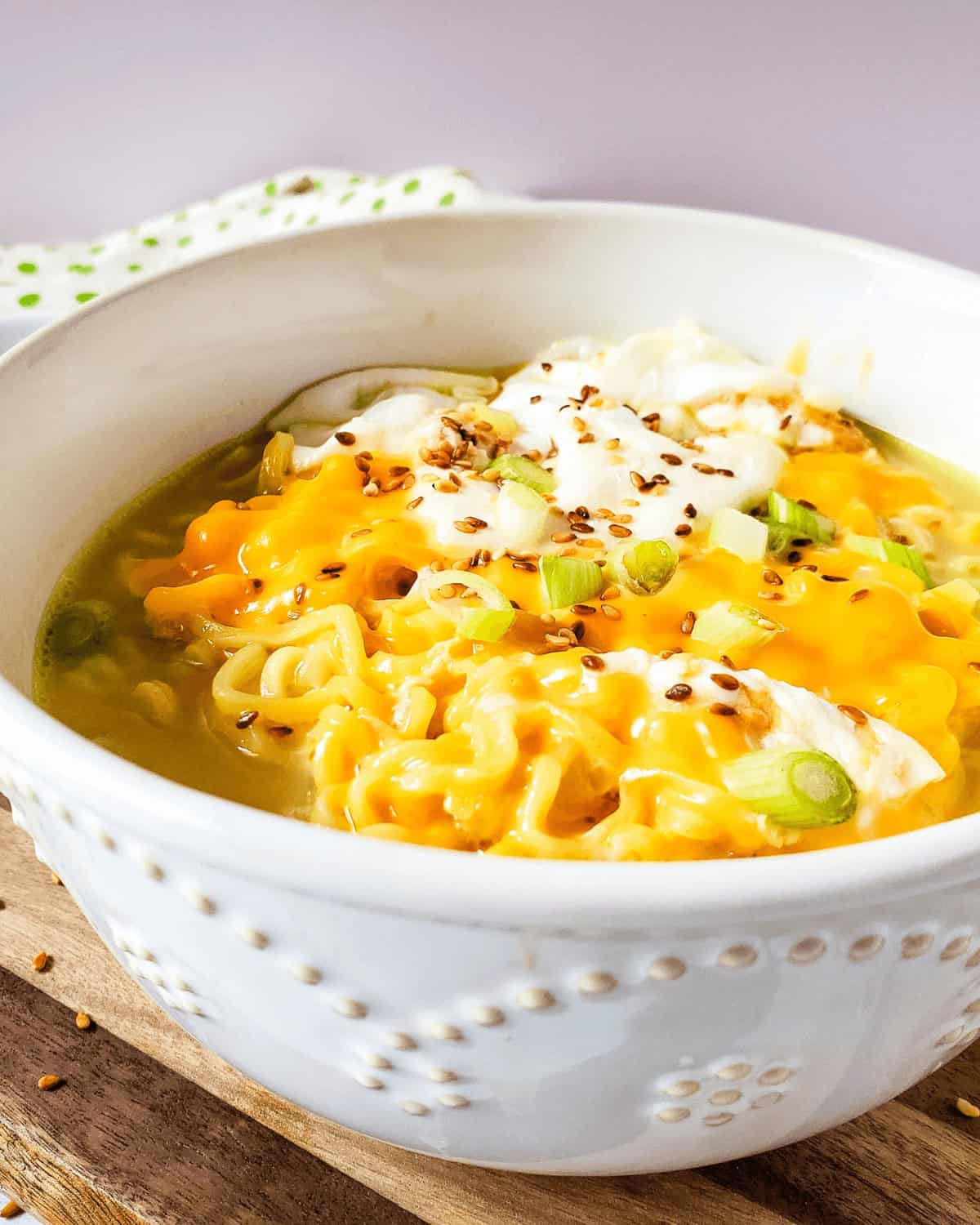 A bowl of ramen mac and cheese in a white bowl. 