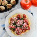 A plate of spaghetti with ricotta meatballs.