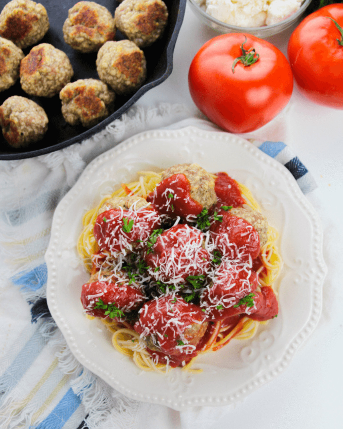 A plate of spaghetti with ricotta meatballs.