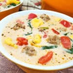 A bowl of Sausage Spinach and Tortellini Soup.