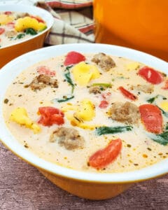 A bowl of Sausage Spinach and Tortellini Soup.