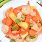 A top shot of a plate of the sheet pan shrimp teriyaki and pineapple dinner.