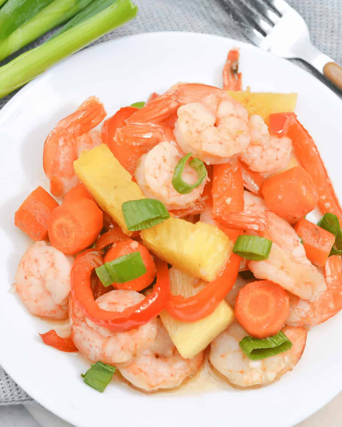 A top shot of a plate of the sheet pan shrimp teriyaki and pineapple dinner.