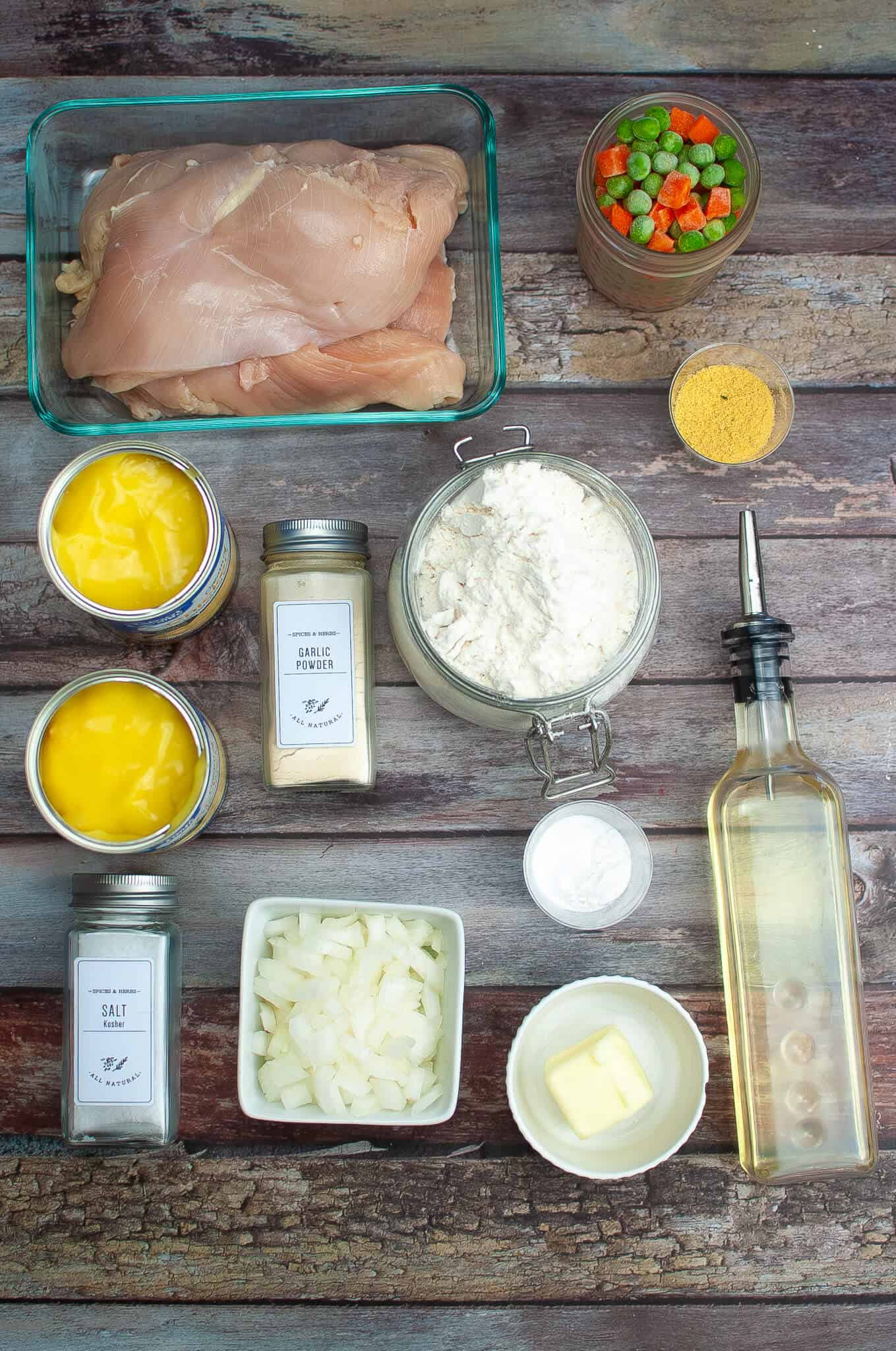 Chicken, stock and ingredients to make the dish.