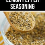 A bowl of lemon pepper seasoning with a spoon.