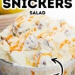 A glass bowl filled with creamy Apple Snickers Salad, topped with a luscious caramel drizzle. Text over the image reads “Apple Snickers Salad Sweet.”.