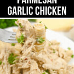 Crock pot garlic parmesan chicken served on a fork, garnished with parsley.