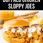 Slow cooker buffalo chicken sloppy joes served on buns with a drizzle of dressing.