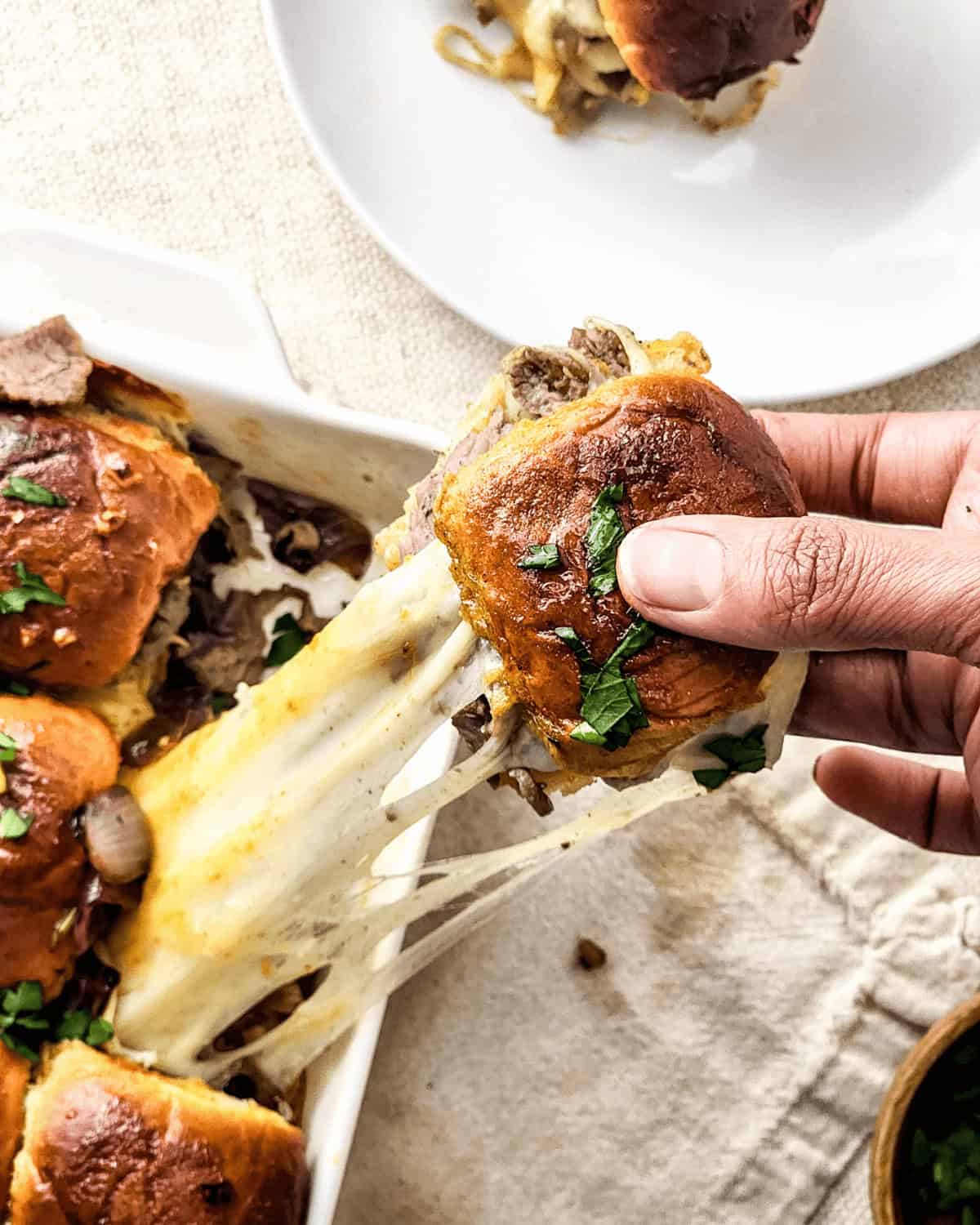A steak and cheese slider.