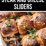 Philly steak and cheese sliders in a baking dish, garnished with parsley.
