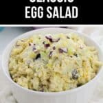 A white bowl filled with Classic Egg Salad, garnished with chopped red onion and celery. Text above reads "Homemade Classic Egg Salad.