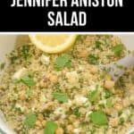 A bowl of quinoa salad with chickpeas, feta cheese, and fresh mint, garnished with a lemon wedge, featuring text overlay "Jennifer Aniston Salad.