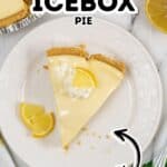 A slice of Lemon Icebox Pie with whipped cream and a lemon garnish sits on a white plate, next to the rest of the pie and lemon pieces, with bold text labels highlighting the classic dessert.