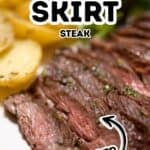 Close-up of juicy Marinated Skirt Steak with fresh herbs, served with roasted potatoes and greens. Text on image reads "Marinated Skirt Steak" and "Tender.