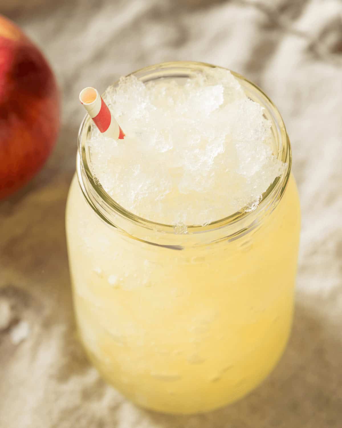 A glass jar filled with the frozen drink.