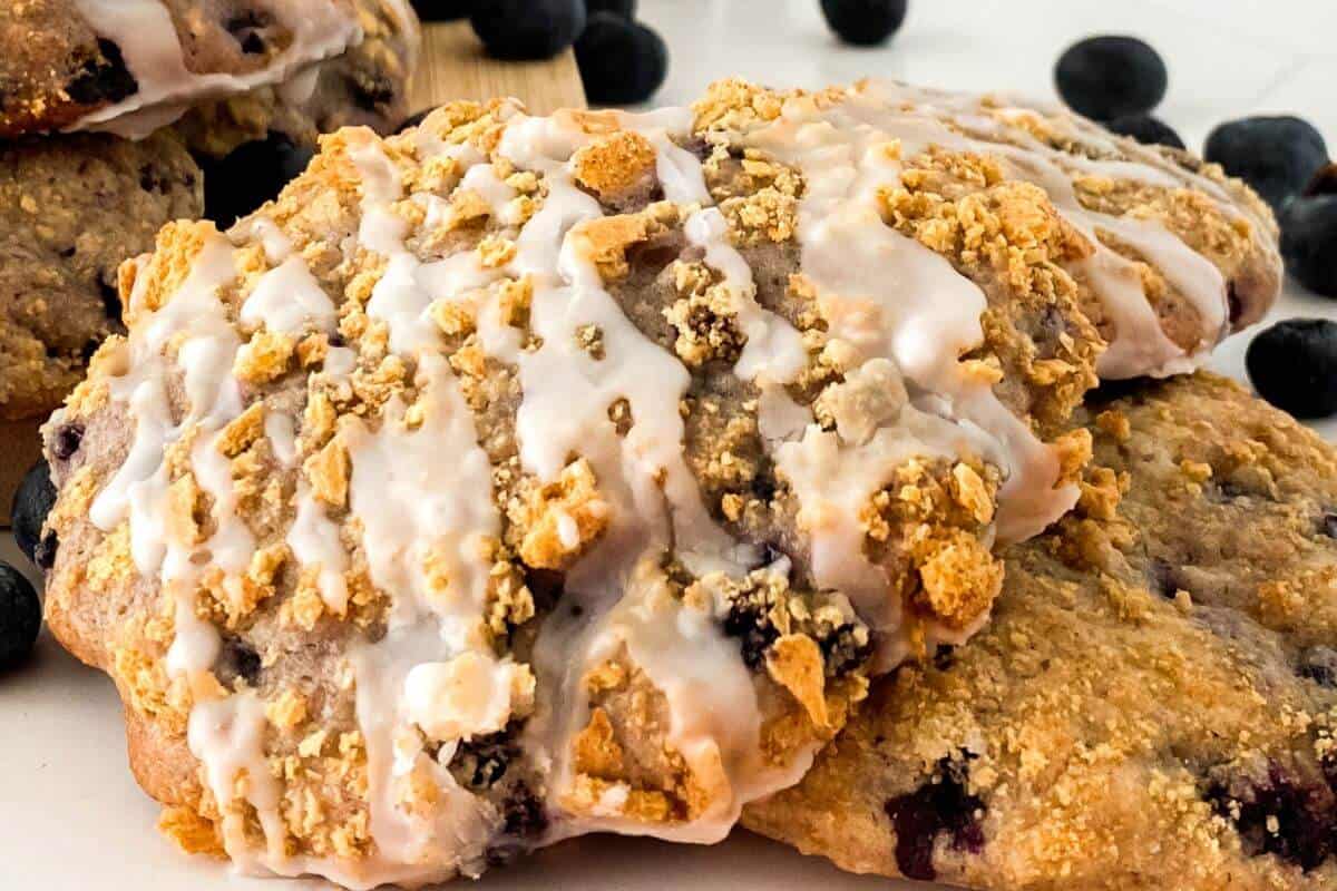 Several blueberry cookies on a table top. 