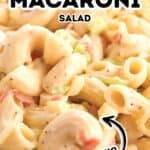 Close-up of macaroni salad with chopped vegetables, creamy dressing, and text reading "Easy Macaroni Salad Recipe" and "Hellman's" on top of the image.