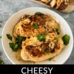 A bowl of cheesy Fajita Stuffed Chicken garnished with cilantro, with additional chicken pieces on a wooden board in the background. Overlay text reads "Cheesy Fajita Stuffed Chicken".