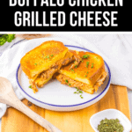 A plate of buffalo chicken grilled cheese sandwiches on a wooden board, accompanied by a small dish of herbs and a wooden spoon beside it.