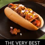 A mouthwatering chili cheese dog, brimming with onions and cheese, sits invitingly on a sleek black plate. Below, the promise rings true: "The Very Best Chili Cheese Dogs.
