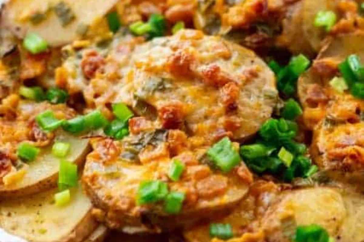 Close-up of campfire potatoes with garnishes. 