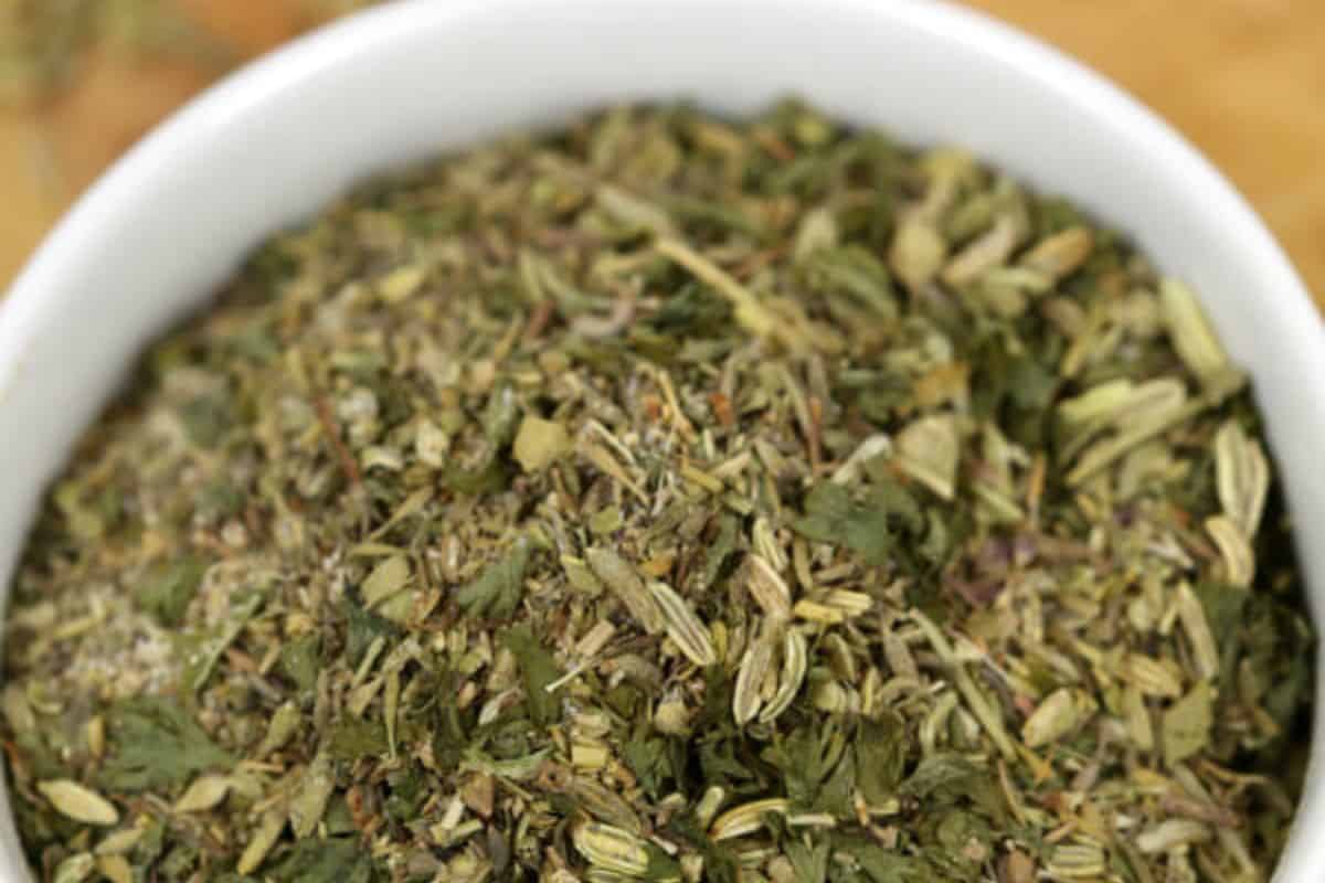 Close-up of 'porketta' seasoning mix in white bowl. 