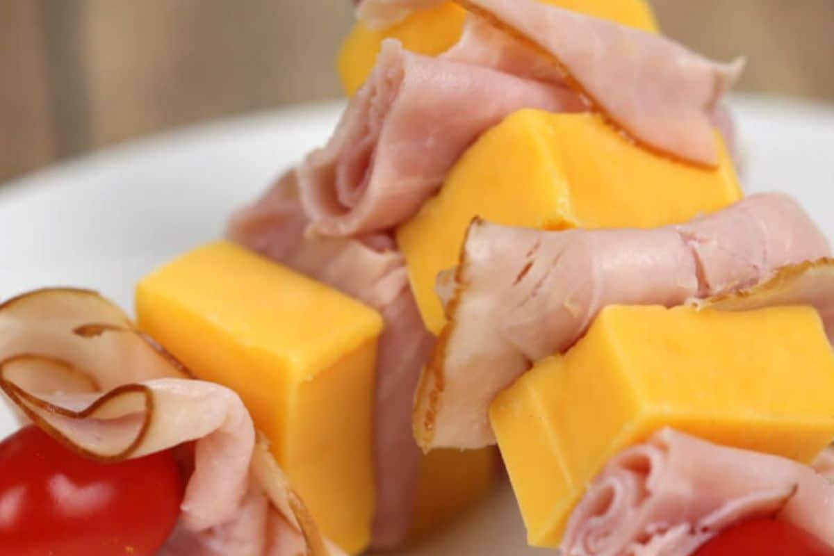 Two ham and cheese skewers. 
