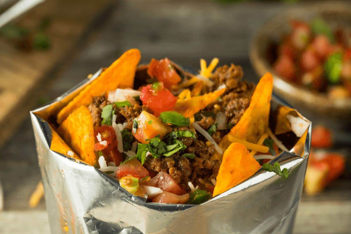 Doritos bag folded over with taco filling and chips inside. 