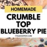 A homemade Crumble Top Blueberry Pie in a baking dish, with a serving spoon and a slice of pie on a white plate.