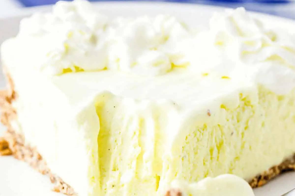 Frozen Lemon pie with cream on top.