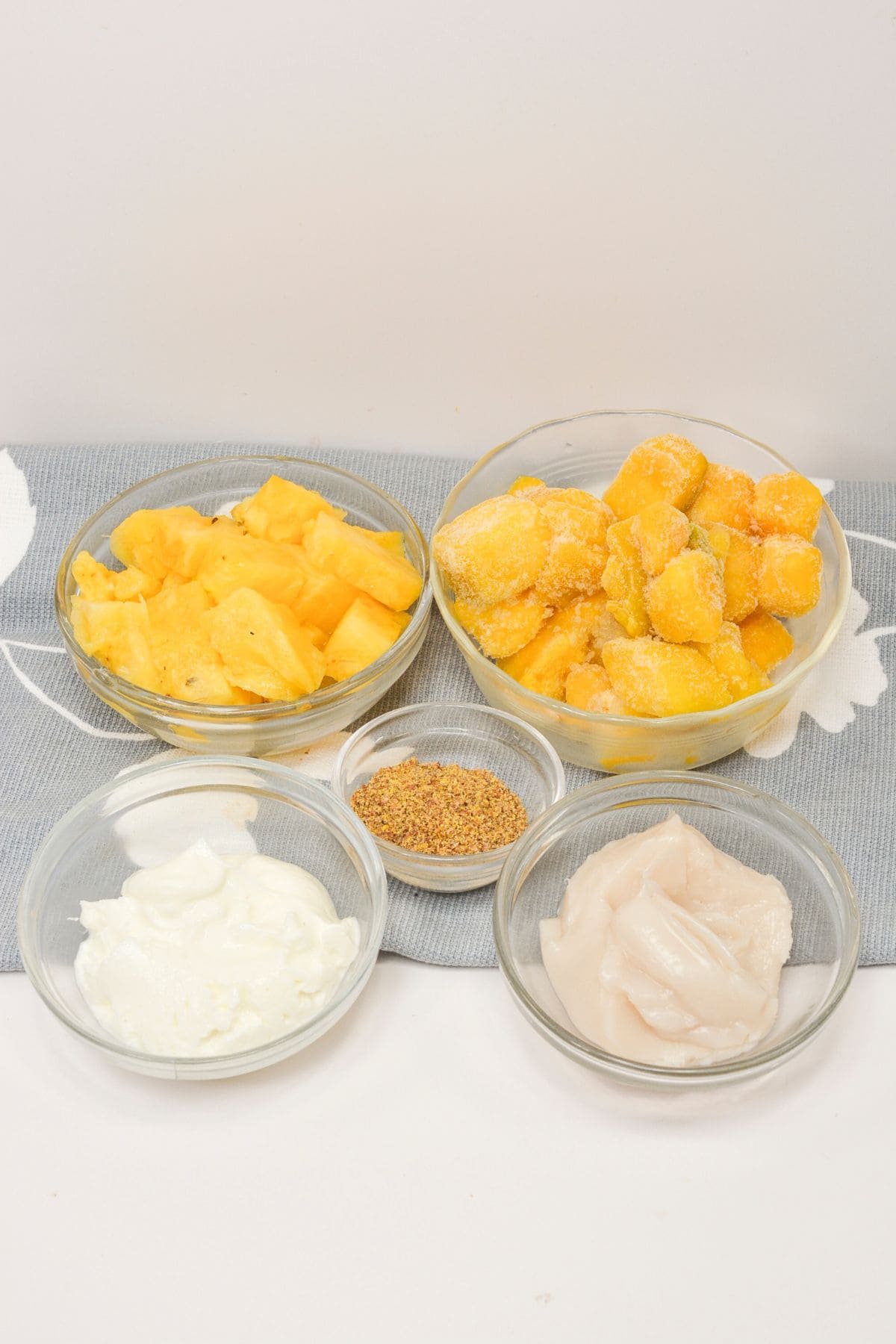 All the fruit and ingredients in glass bowls.