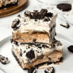 Oreo ice cream cake on a white plate.