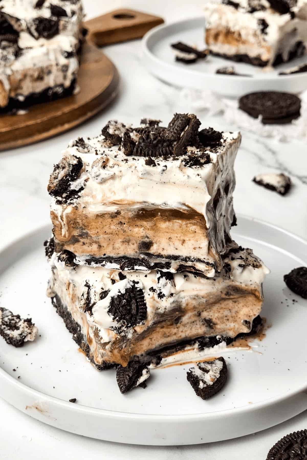 Oreo icecream cake on a white plate.