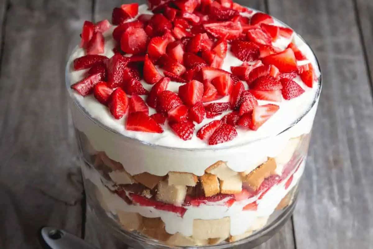 Close-up of a strawberry angel food cake dessert on a wooden table.