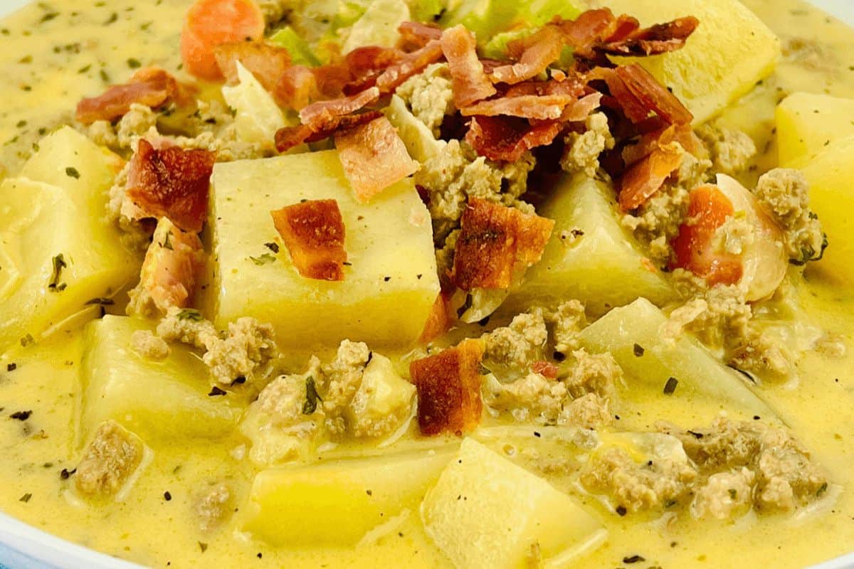 Close-up of yellow bacon cheeseburger soup.