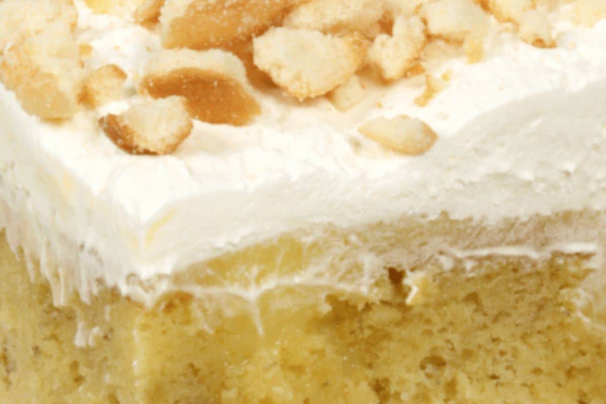 Banana poke cake with nuts on top. 