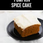 A piece of frosted pumpkin spice cake on a black plate with text above reading "2 Ingredient Pumpkin Spice Cake.