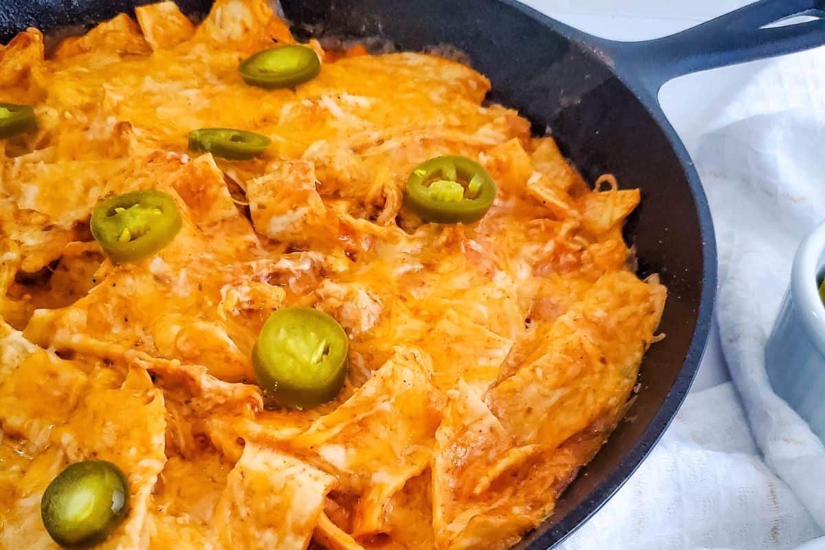 Chicken enchilada skillet with jalapenos on top. 